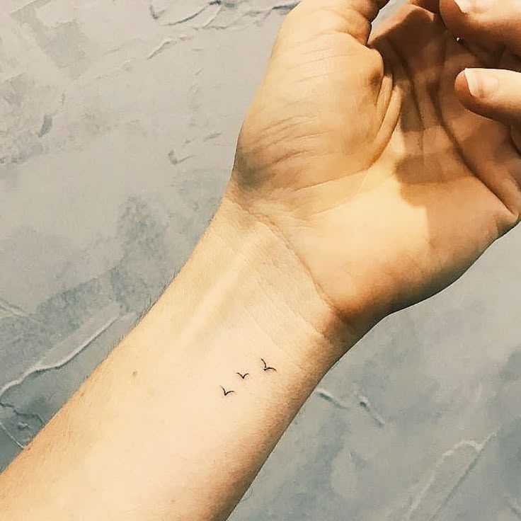 Tiny Birds on Wrist - Minimalist Fine Line Tattoo