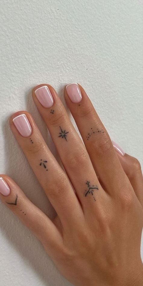 delicate minimalist finger tattoo inspiration