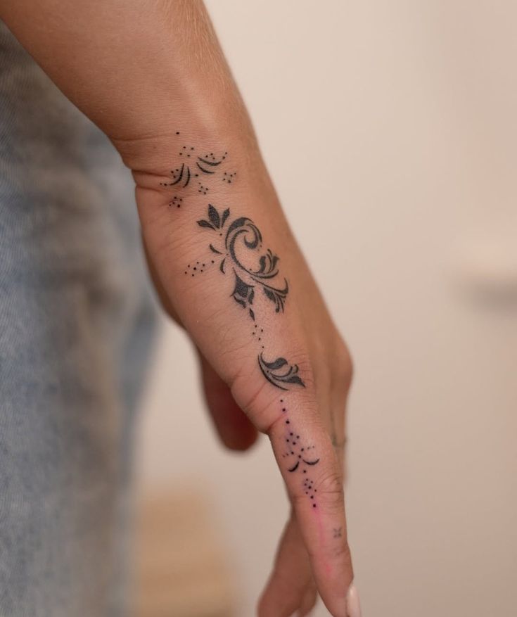 Elegant Blackwork Finger Tattoo Design