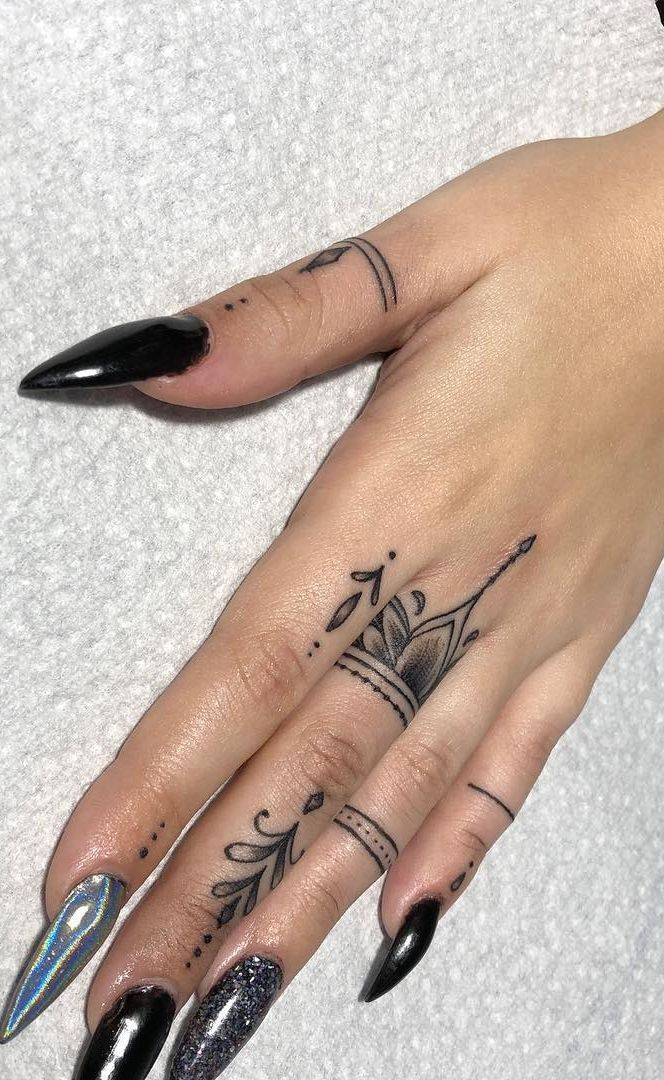 Elegant Blackwork Finger Tattoo Design