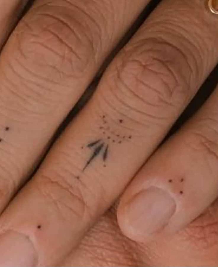 delicate minimalist finger tattoo design