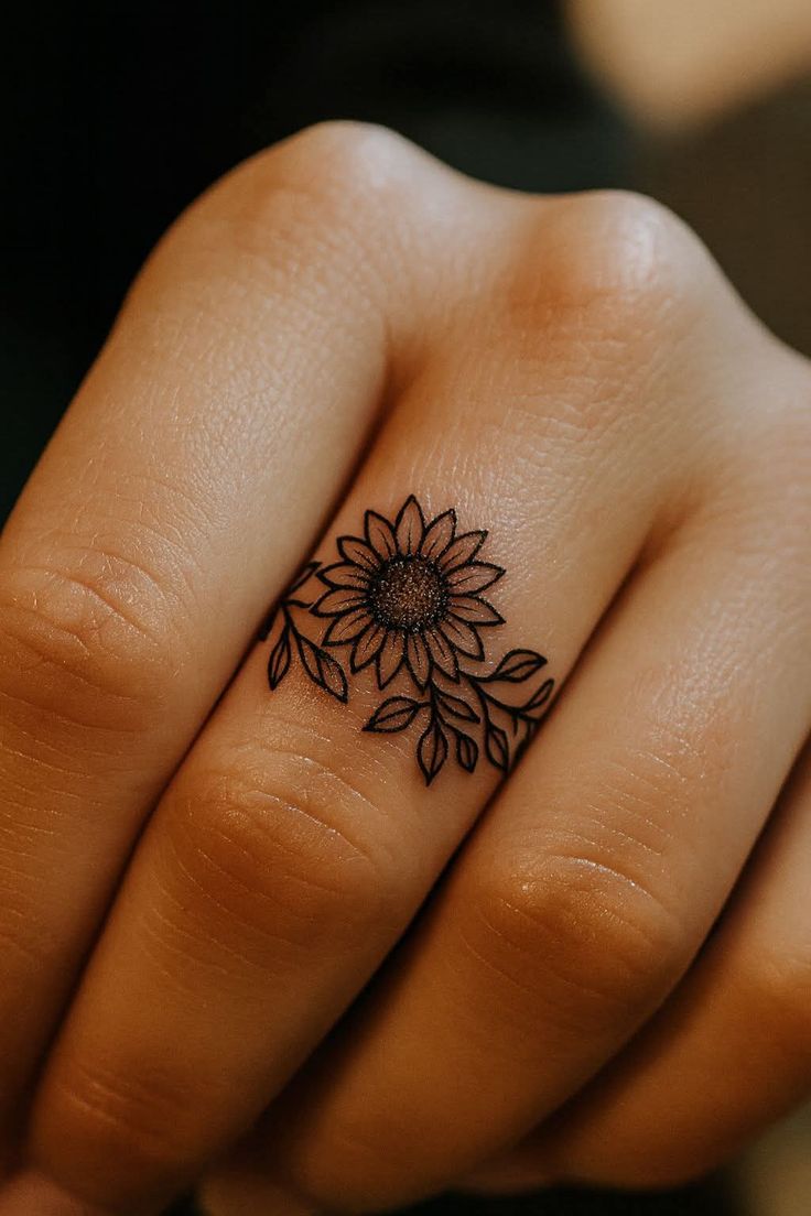 delicate sunflower finger tattoo design