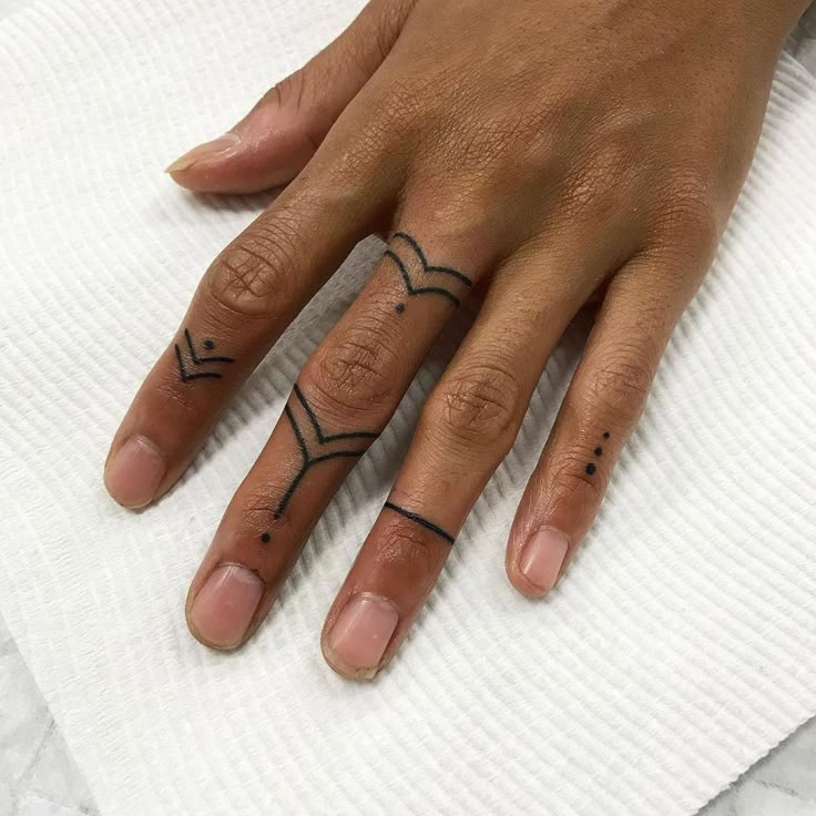 minimalist geometric finger tattoo inspiration