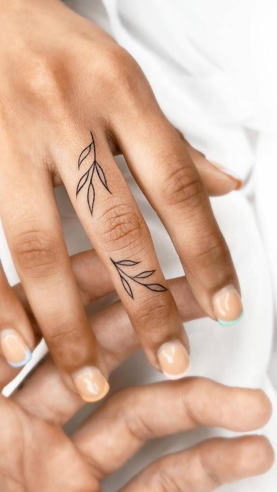 delicate leaf finger tattoo design