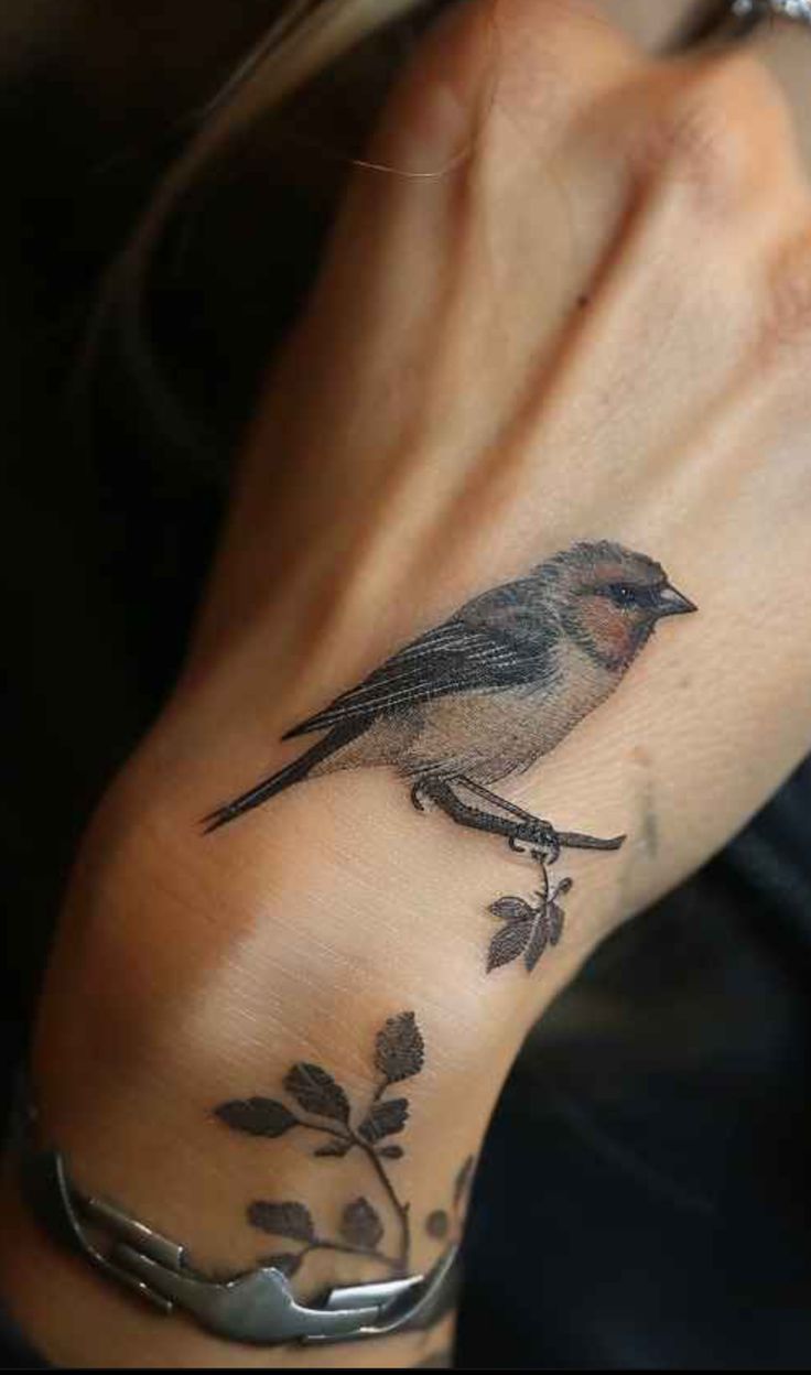 realistic bird hand tattoo inspiration