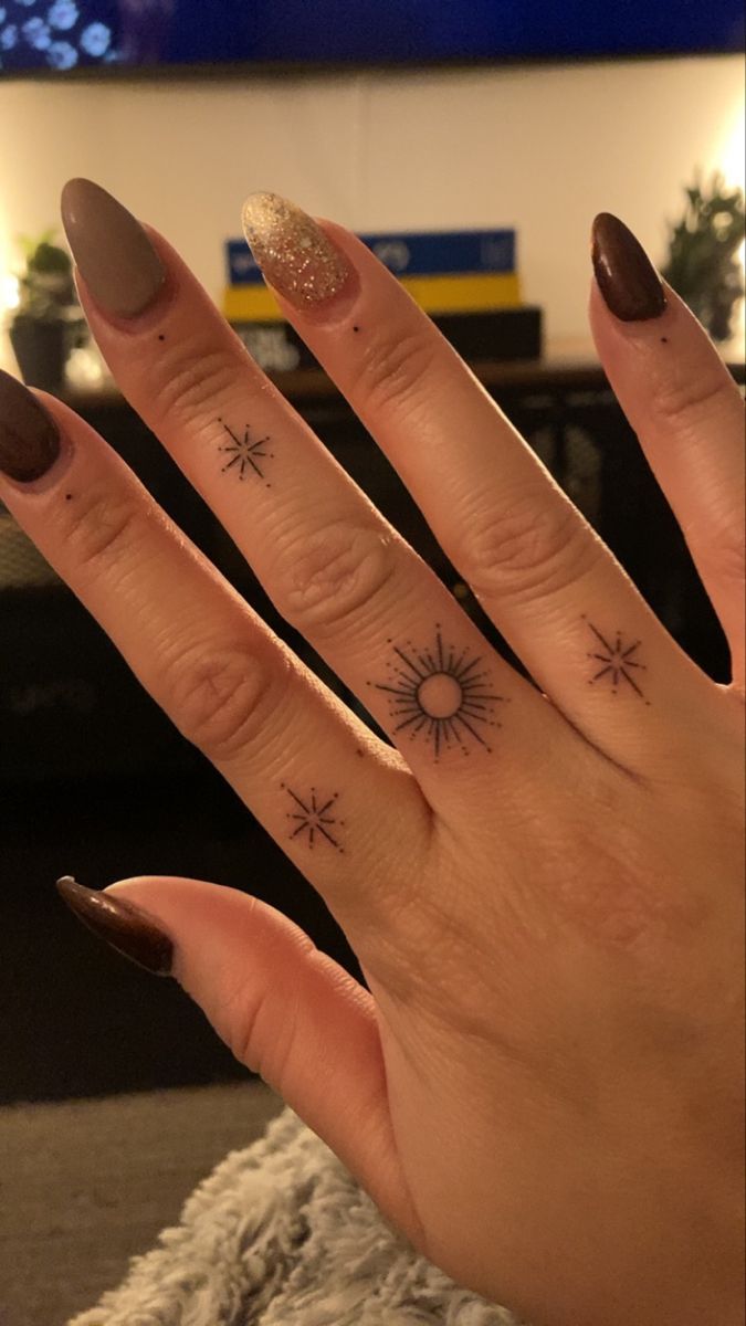 Minimalist Sun and Stars Finger Tattoo Design