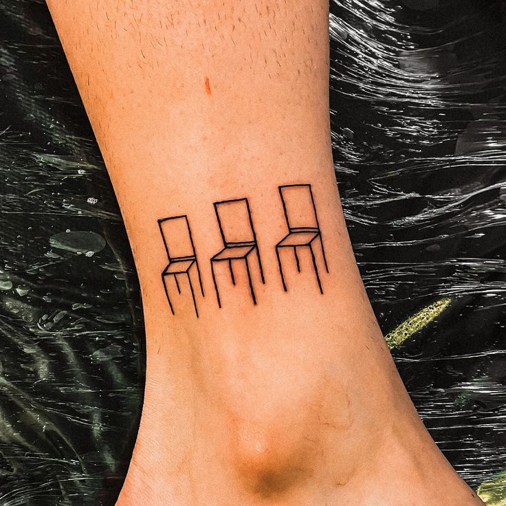 minimalist chair tattoo design for the ankle