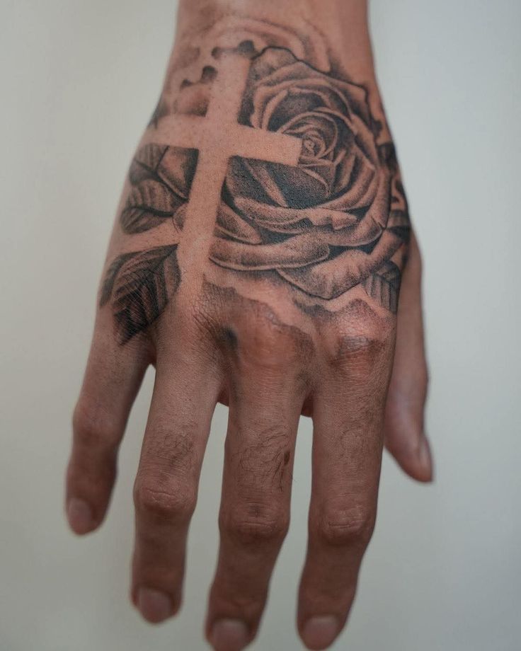 Intricate Rose and Cross Hand Tattoo Design