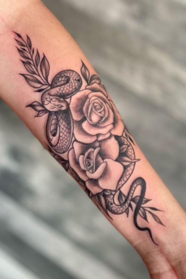 Elegant Snake and Roses Forearm Tattoo