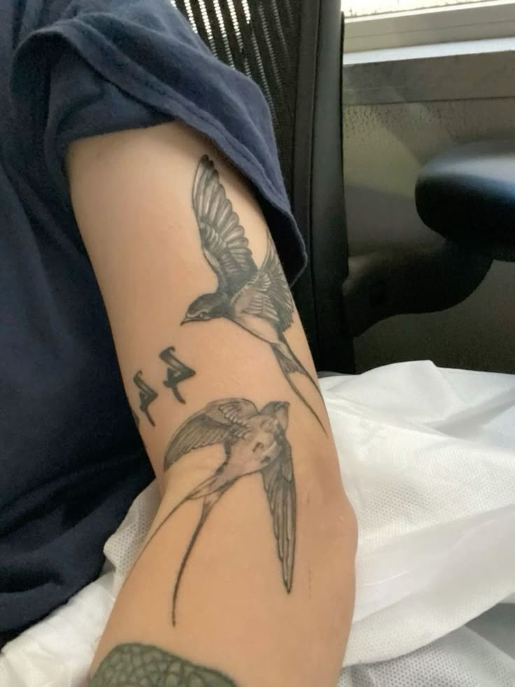 Elegant Bird Forearm Tattoo