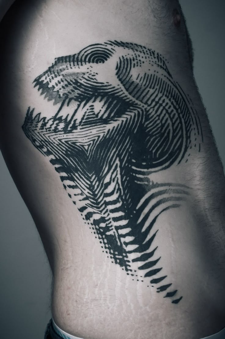 Bold Geometric Ribcage Tattoo Design