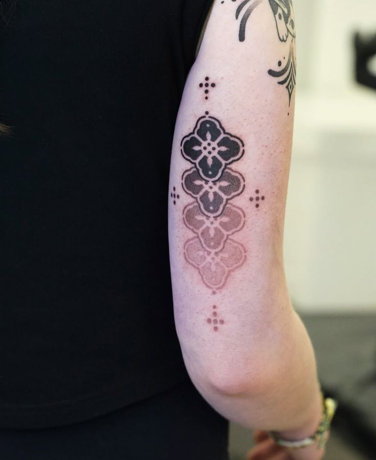Elegant Geometric Arm Tattoo Design