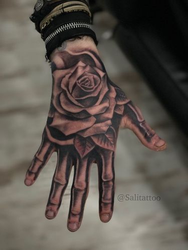 Stunning Realistic Rose Hand Tattoo Design