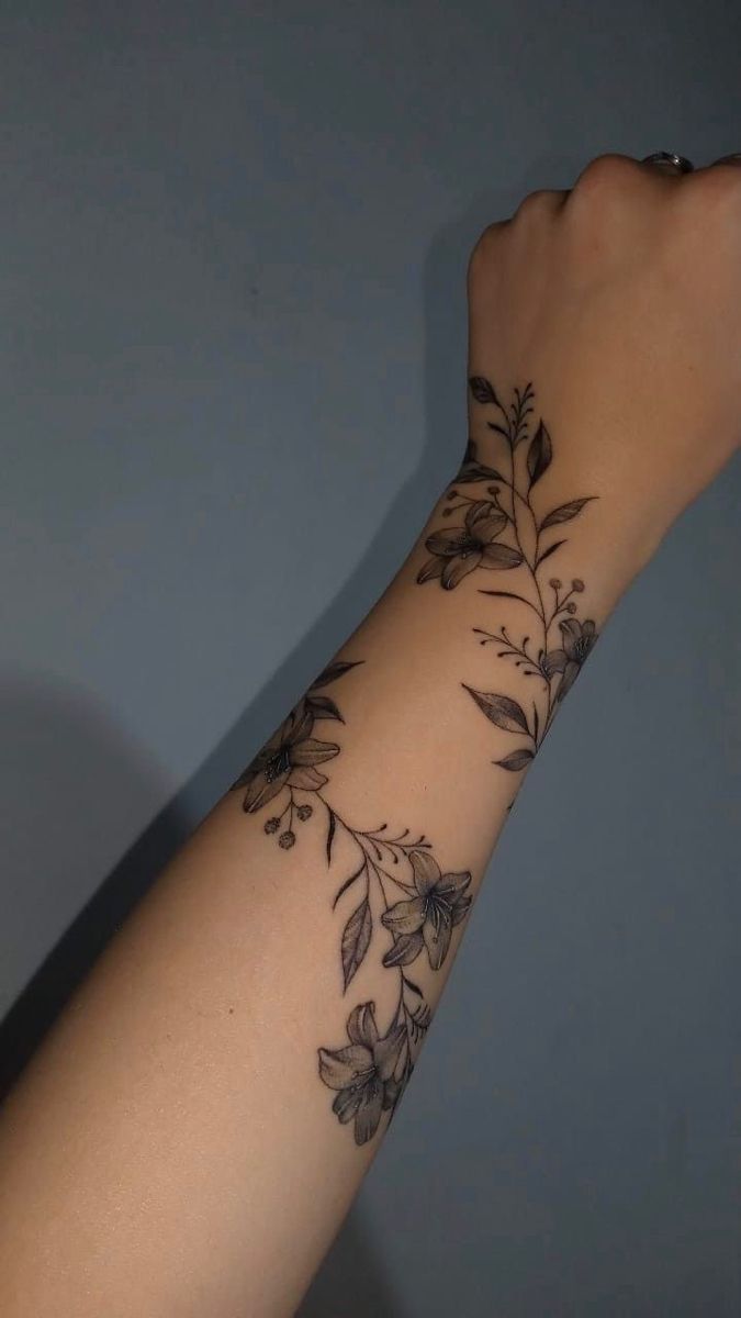 elegant floral hand tattoo design