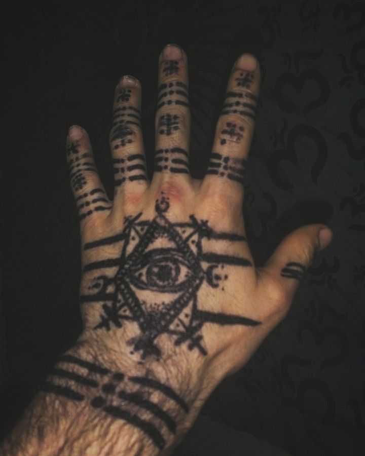 mystical geometric hand tattoo design