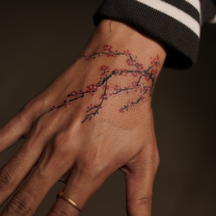 cherry blossom hand tattoo design