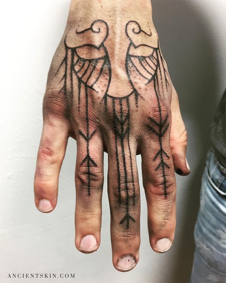 intricate blackwork hand tattoo design