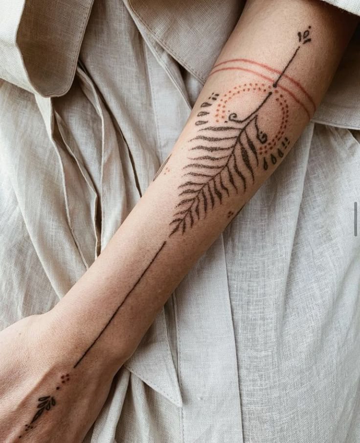 elegant fern hand tattoo design