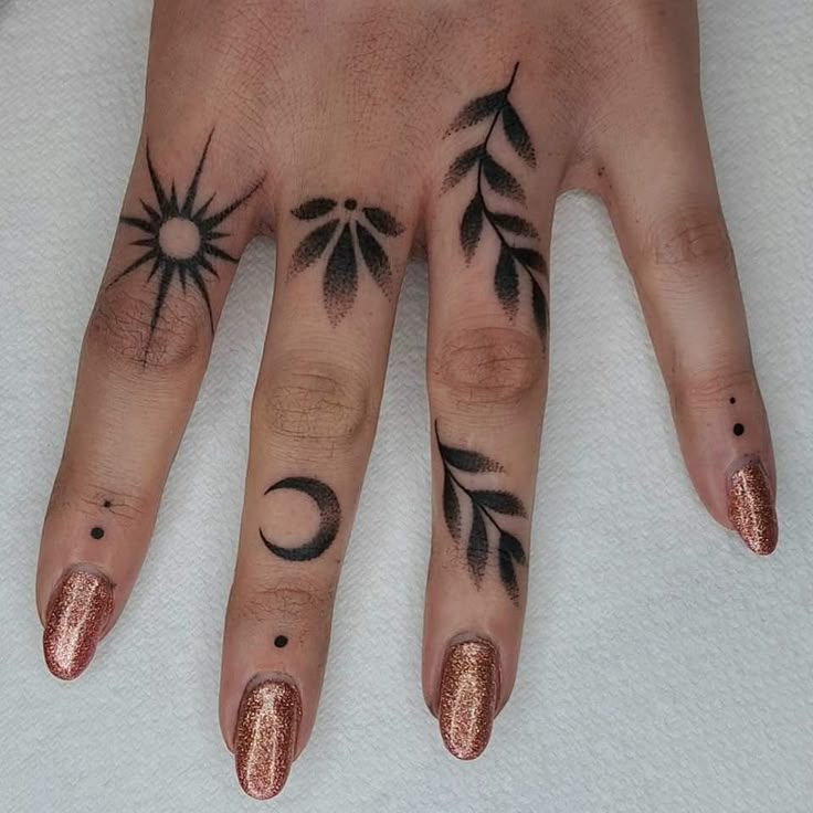 nature-inspired blackwork hand tattoo