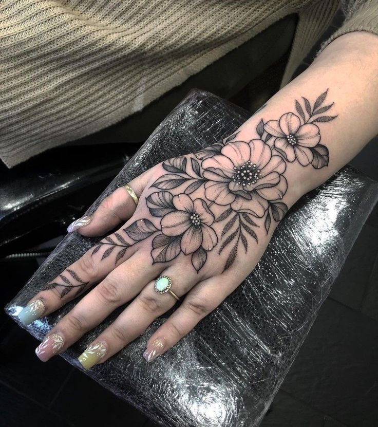 elegant floral hand tattoo design