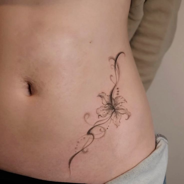 Elegant Lily Swirl Hip Tattoo