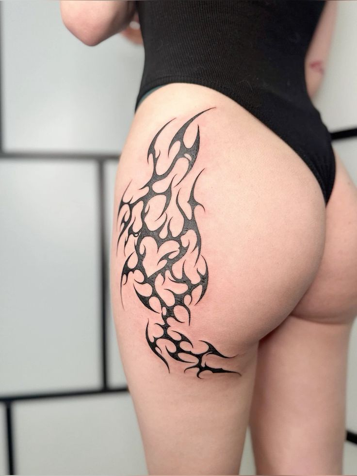 Bold Tribal Hip Tattoo Design