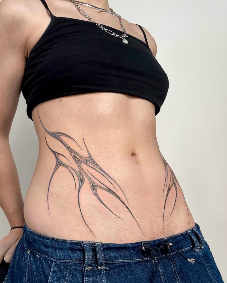 Stunning Abstract Hip Tattoo for Modern Women