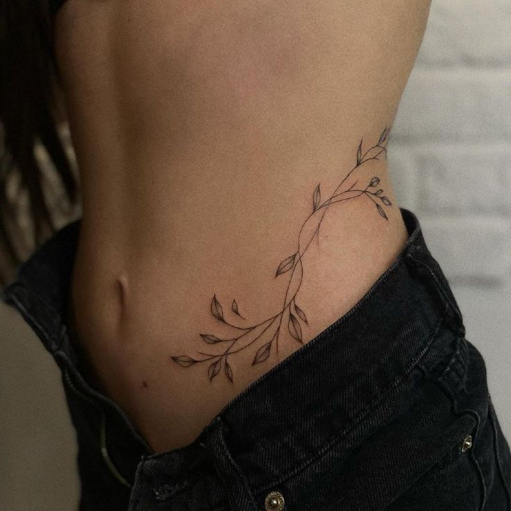 Delicate Minimalist Hip Tattoo with Leaves