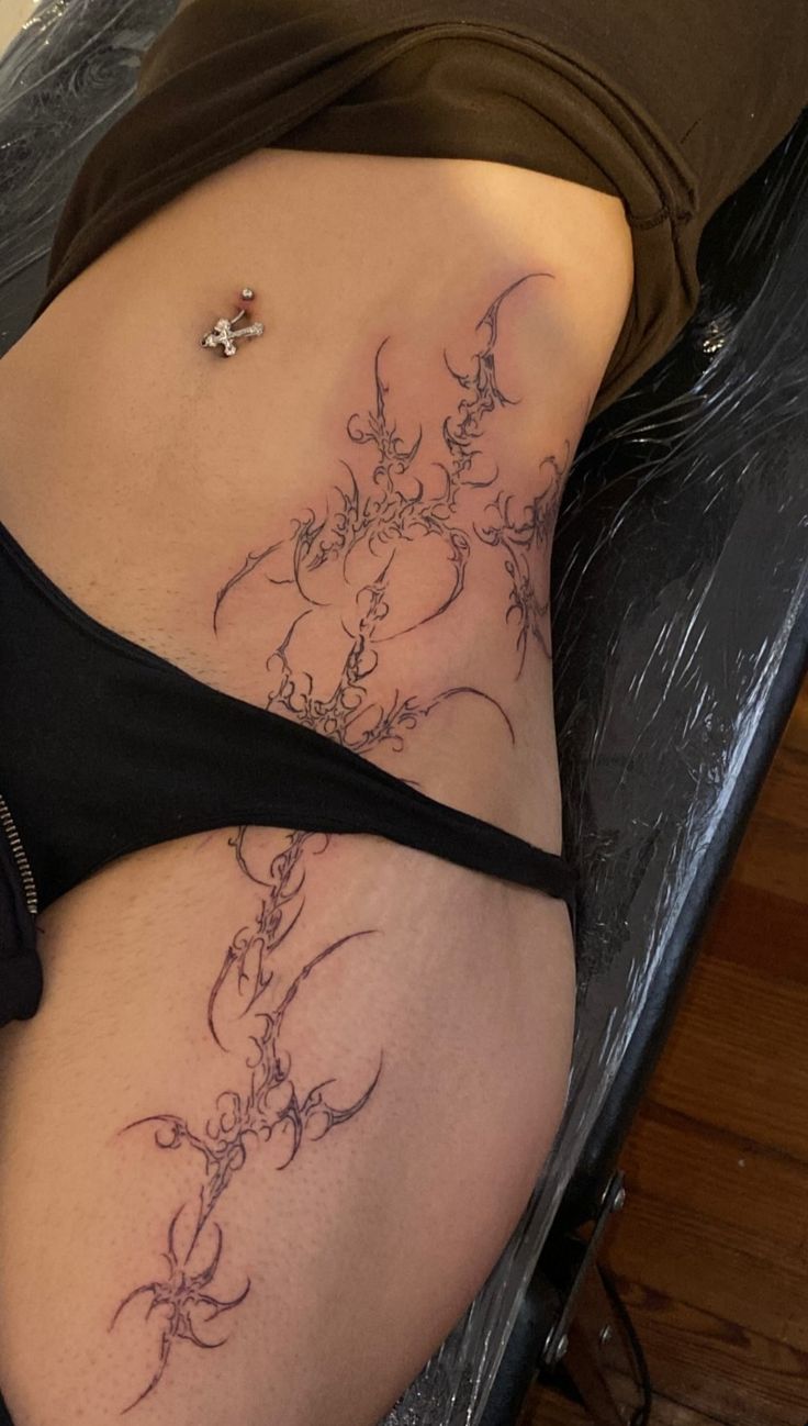 Intricate Blackwork Hip Tattoo Design