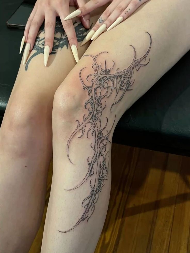 Elegant Tribal Thigh Tattoo Design