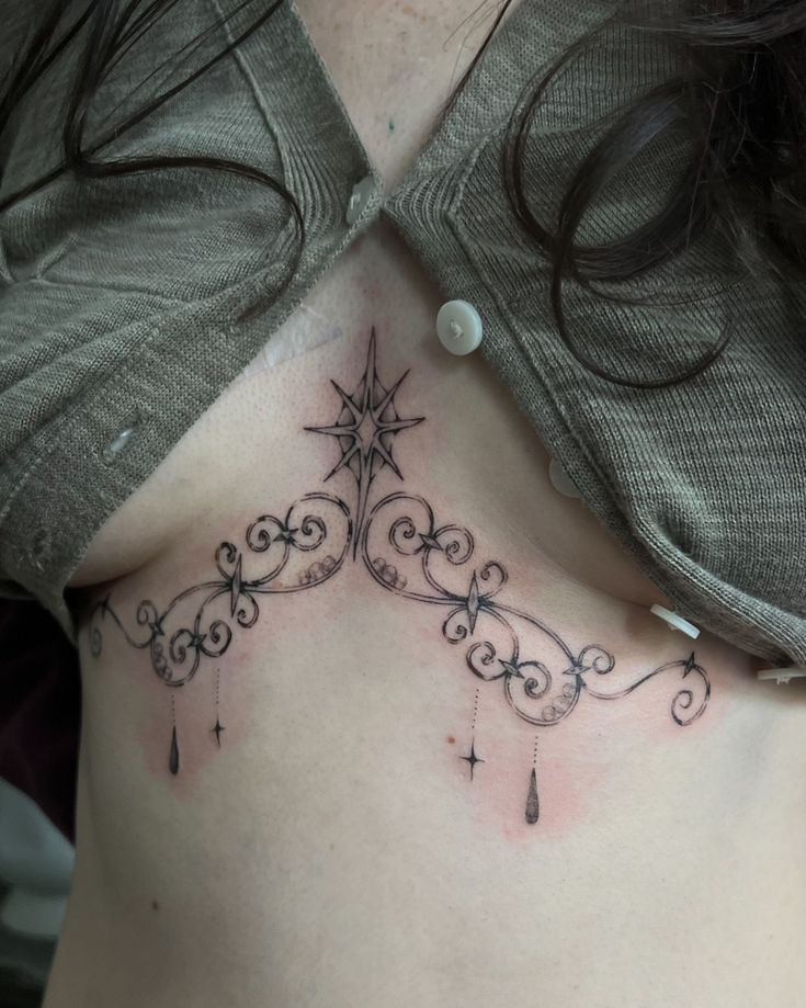 elegant illustrative chest tattoo