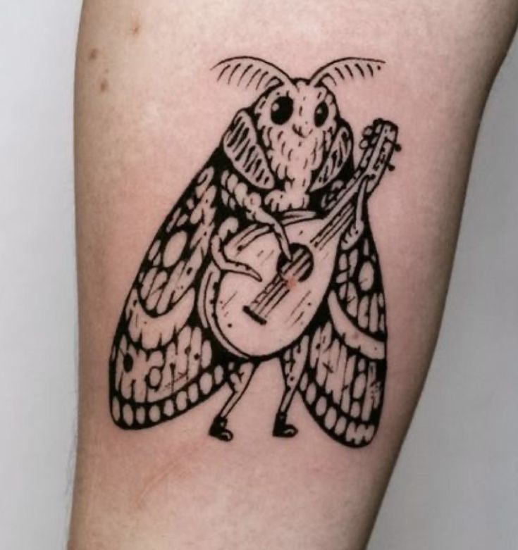 Whimsical Moth Tattoo with Guitar