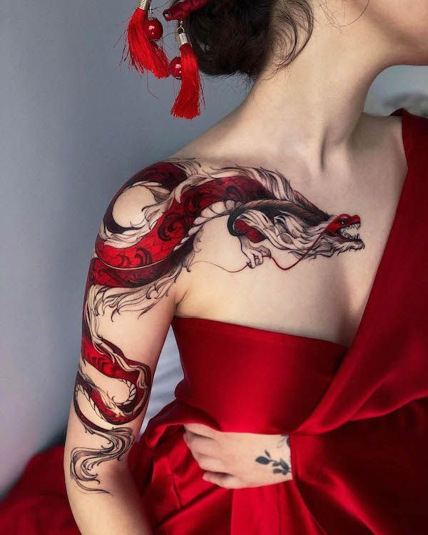 beautiful red dragon on woman shoulder