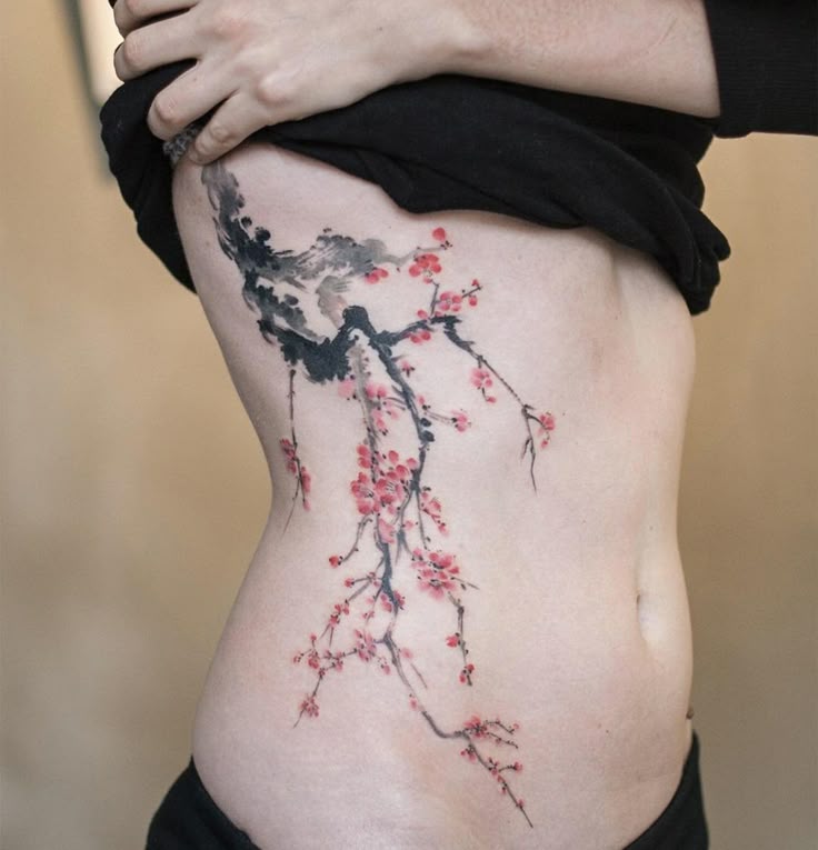 Elegant Cherry Blossom Ribcage Tattoo