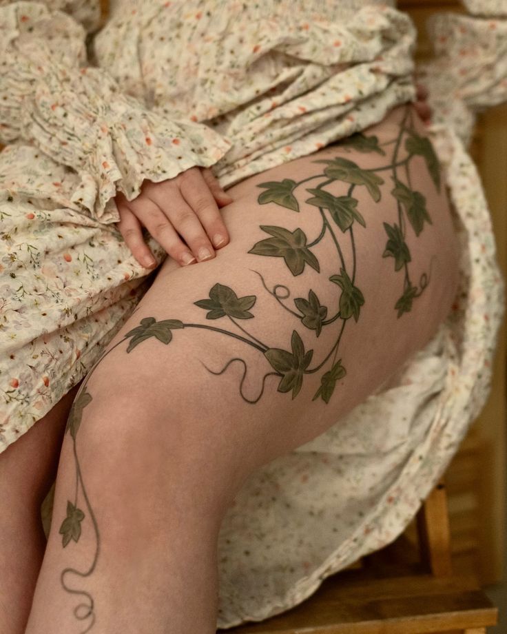 elegant ivy thigh tattoo design