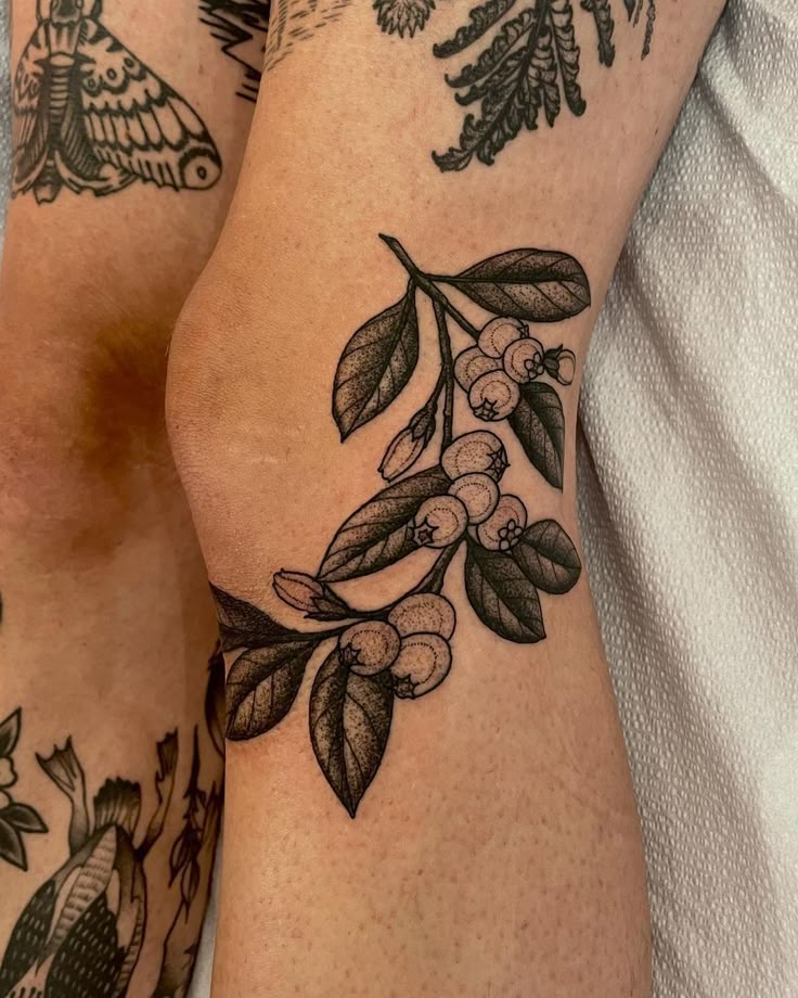 elegant floral knee tattoo design