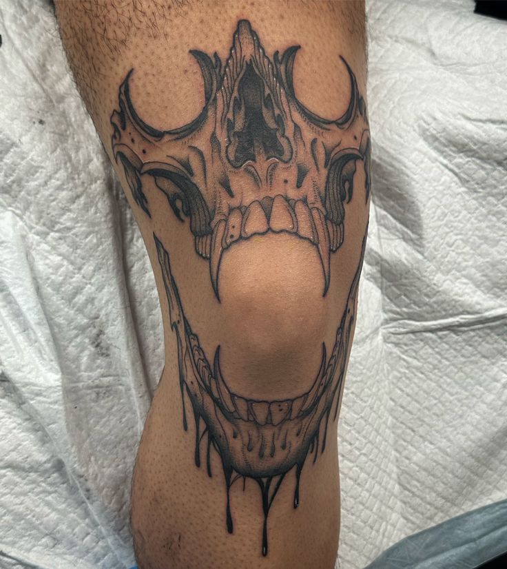 Bold Blackwork Skull Knee Tattoo