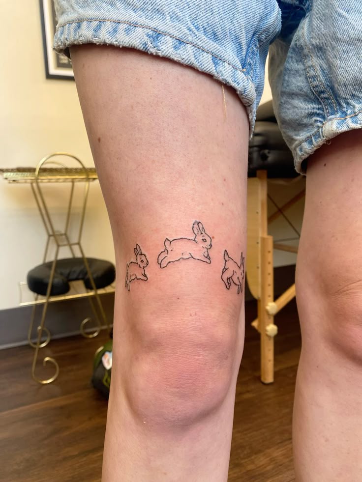 playful rabbit knee tattoo design