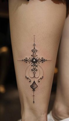 Elegant Blackwork Leg Tattoo Design