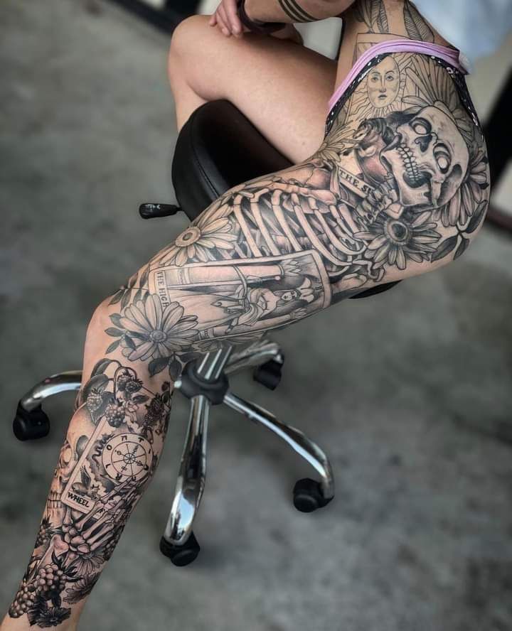 Intricate Blackwork Leg Tattoo with Floral Elements