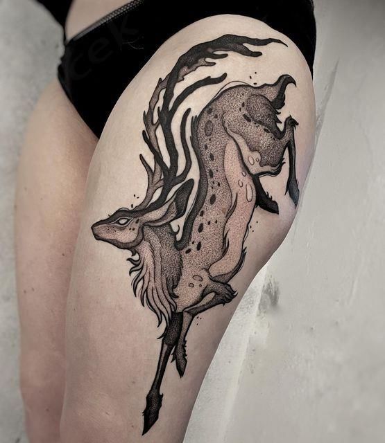 Elegant Faunwood Thigh Tattoo