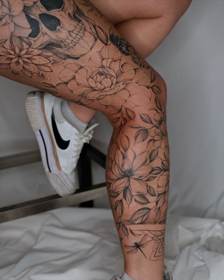 elegant floral leg sleeve tattoo