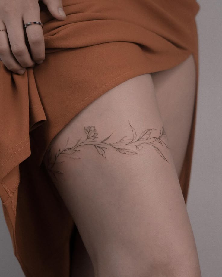 Elegant Floral Thigh Tattoo