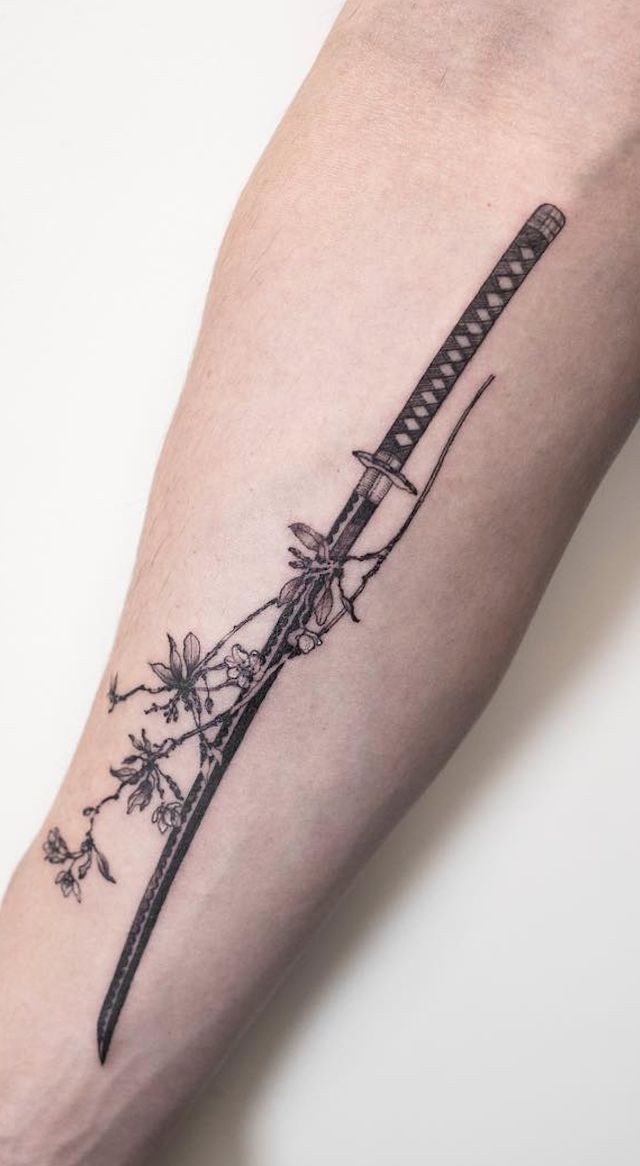 Elegant Katana Tattoo with Floral Accents