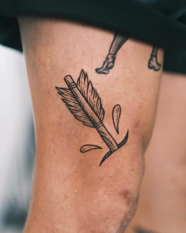 Minimalist Arrow Tattoo with Feather Design