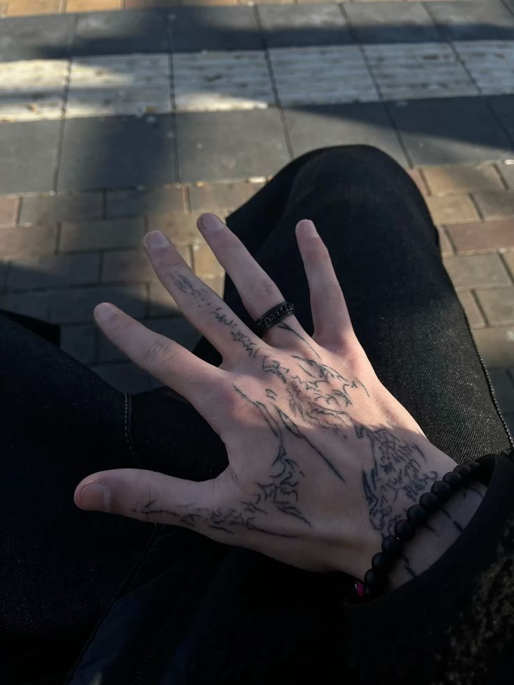 intricate blackwork hand tattoo