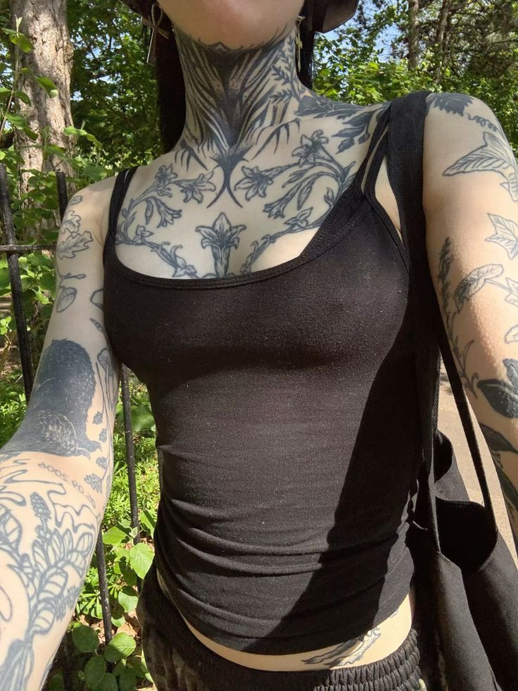 Bold Blackwork Floral Chest Tattoo