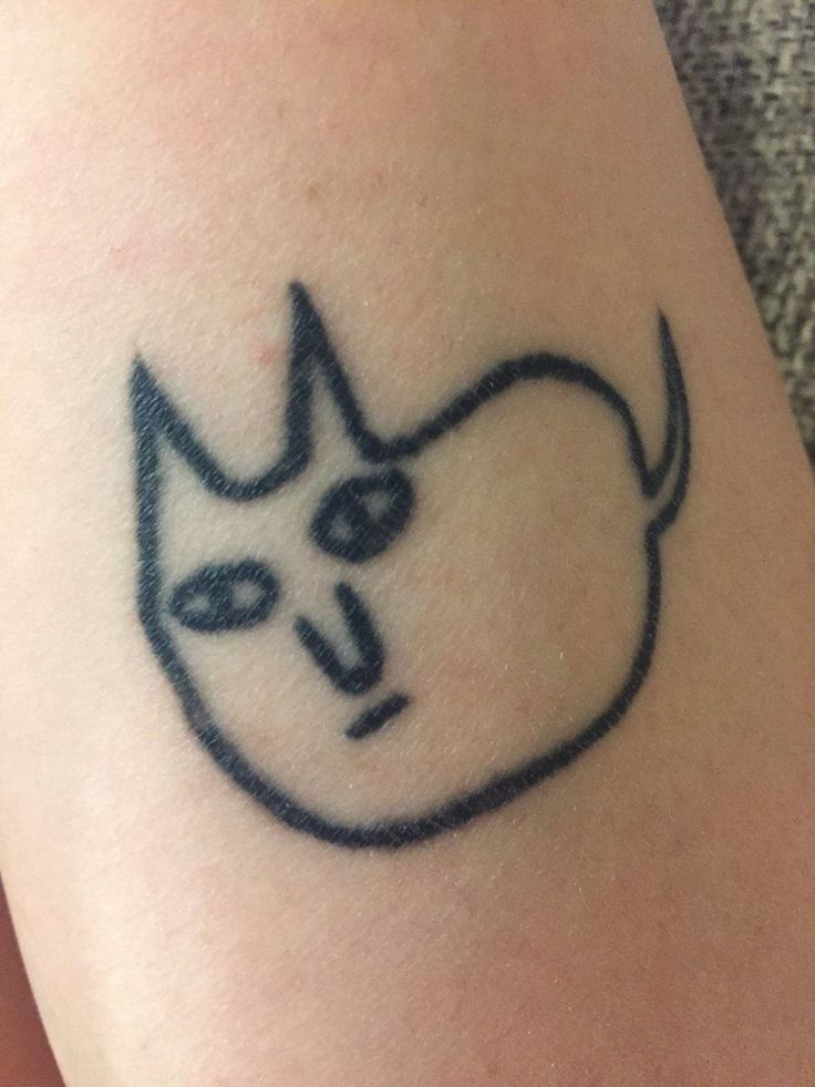 Charming Minimalist Cat Tattoo