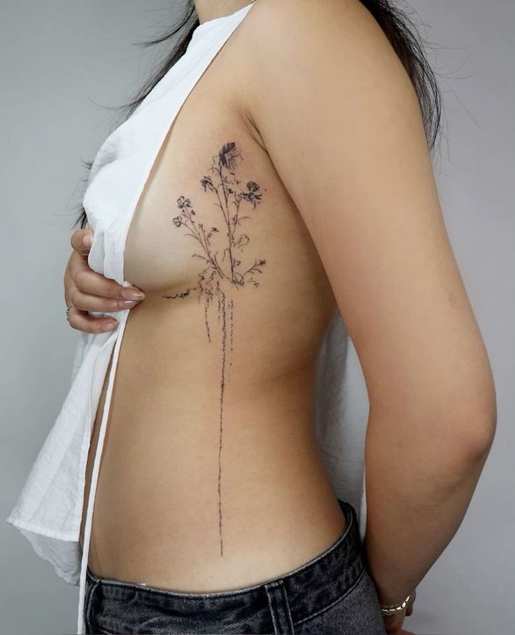 Delicate Floral Minimalist Ribcage Tattoo