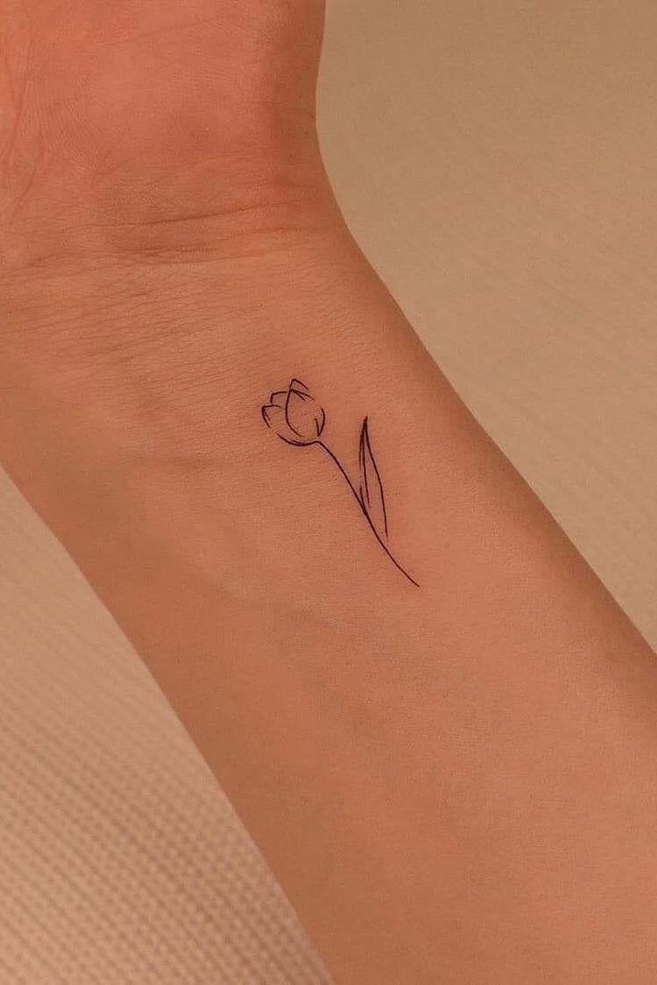 Delicate Minimalist Flower Tattoo